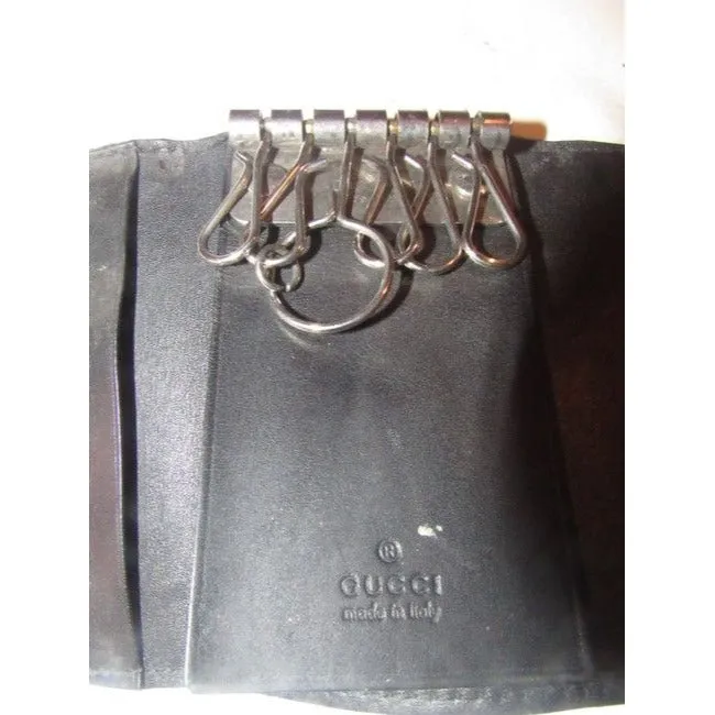 Gucci, black leather, snap close, tri-fold, key holder/card holder, mini- wallet w chrome accents & slots for your cards & six key holders