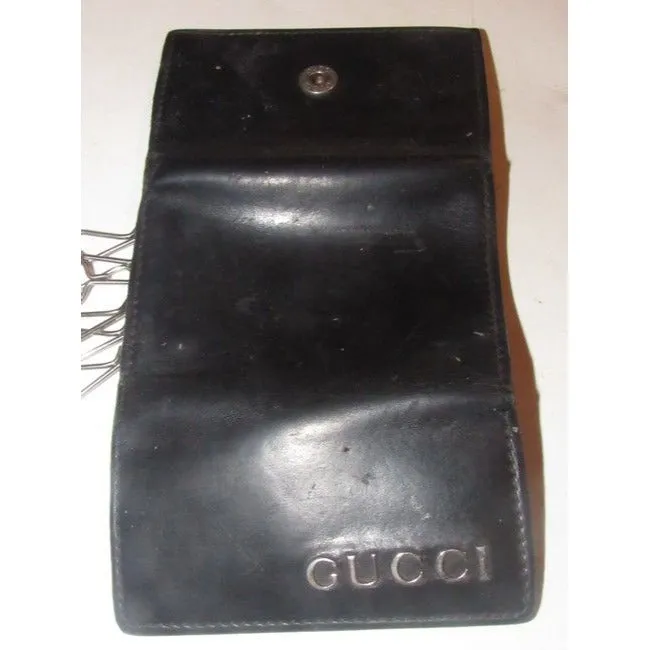 Gucci, black leather, snap close, tri-fold, key holder/card holder, mini- wallet w chrome accents & slots for your cards & six key holders